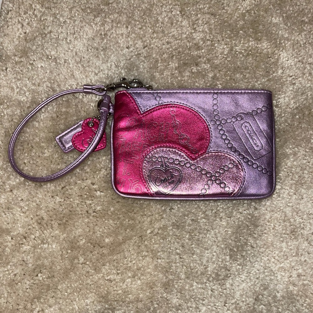 Super cute Valentine edition Coach wristlet. Never before worn.